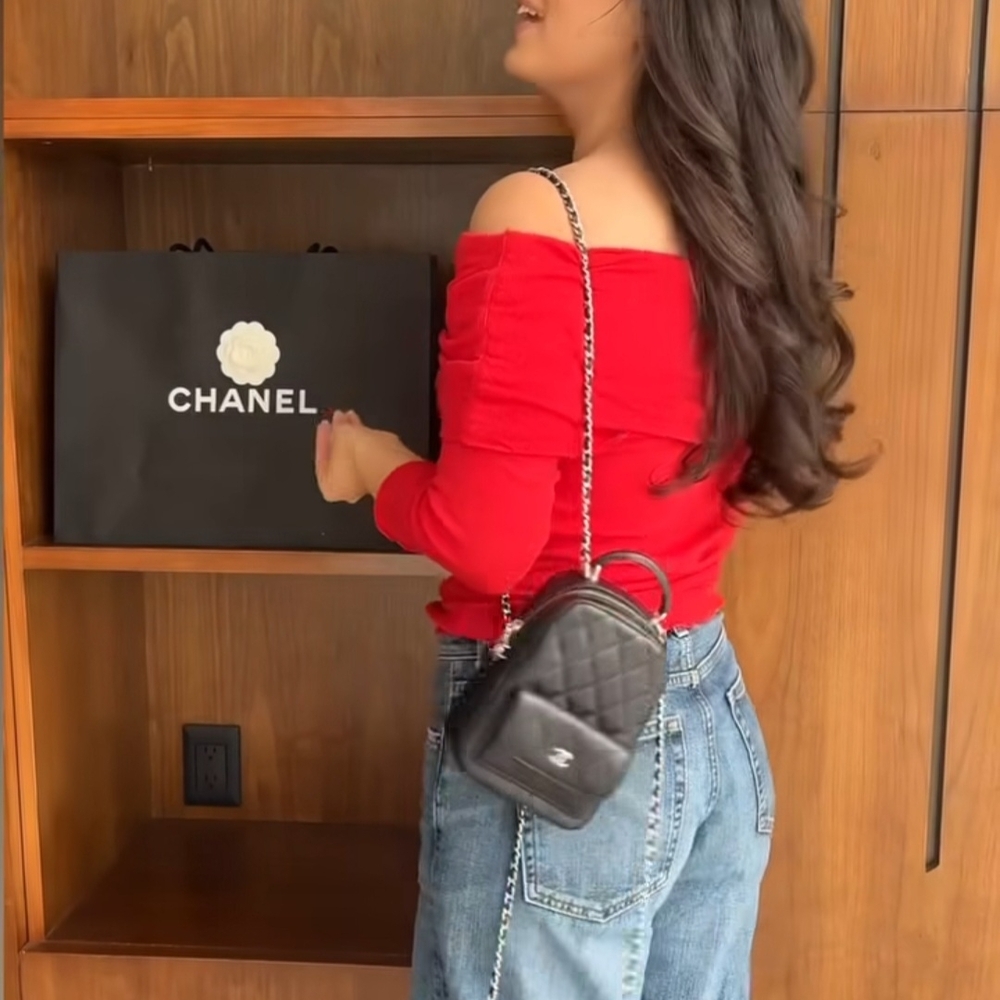 CHANEL Black Mini Backpack with Red Top